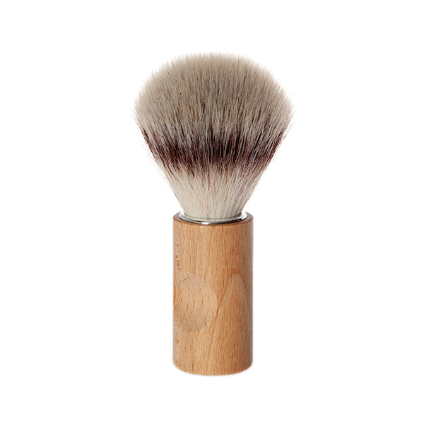Shaving brush with wooden handle on a white background
