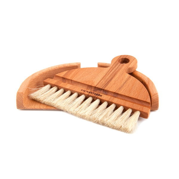 Wooden brush with bristles on a white background