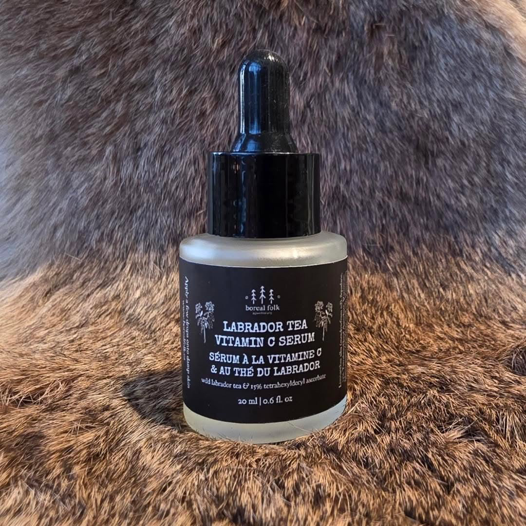 Bottle of Labrador Tea Vitamin C Serum on a fur background