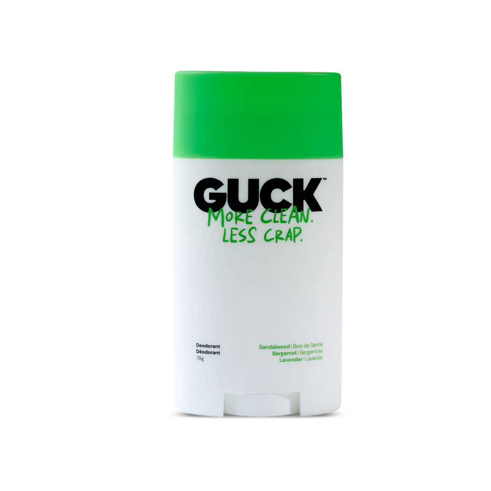 Deodorant stick with green cap and white body on a white background