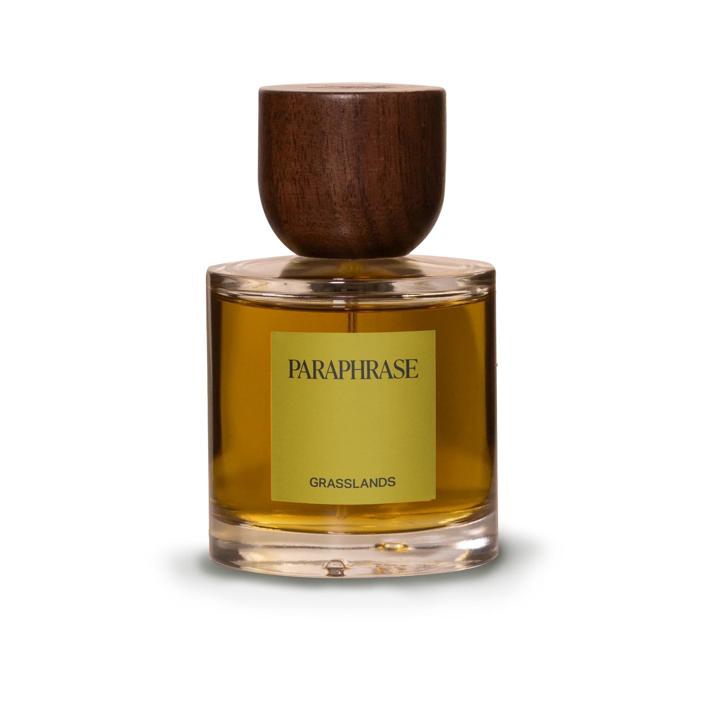 Paraphrase Grasslands 50mL Eau de Parfum in a glass bottle with amber liquid, wooden cap, and PARAPHRASE GRASSLANDS label, embodying prairie sunset scents.