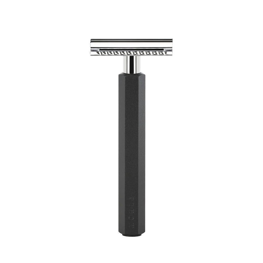 The Mühle Hexagon Safety Razor is displayed upright against a white background, featuring a shiny silver head and a long, textured black anodised aluminum handle—an embodiment of modern shave culture and the signature elegance of Mühle’s Hexagon design.