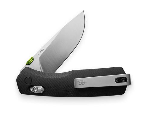 James Carter folding pocket knife with a partially open VG-10 stainless steel blade, black textured handle, and pocket clip, ideal for everyday carry and diverse environments.