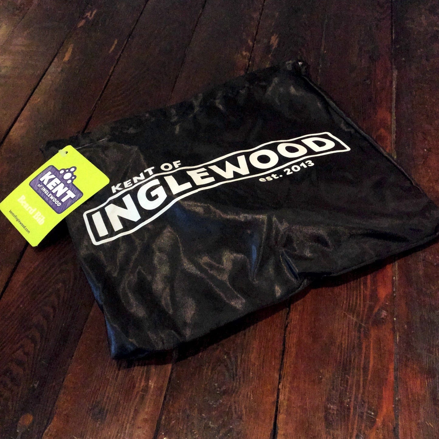 Black fabric pouch with KENT OF INGLEWOOD est. 2013 in white, featuring a bright tag for the Beard Line Up Kit, including a detailing razor and accessories.