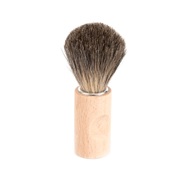 Iris Hantverk Badger Hair Shaving Brush with dense bristles on a wooden handle, ideal for creating lather and providing a smooth, classic shaving experience.