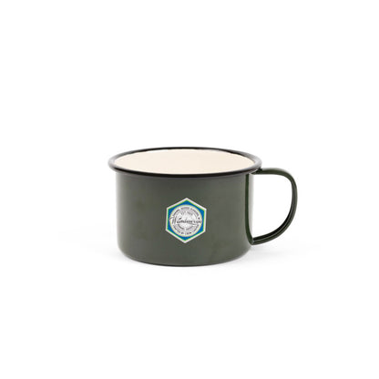 Crow Canyon Camp Wandawega Enamel Soup Mug, forest green with cream interior and hexagonal logo, ideal for camping and outdoor adventures, reflecting timeless simplicity and durability.