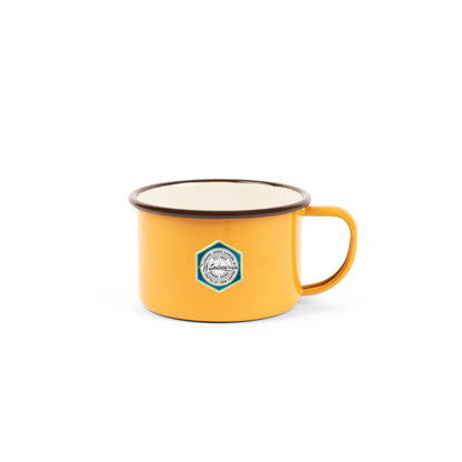 Crow Canyon Camp Wandawega Enamel Soup Mug in warm yellow with a hexagonal badge, symbolizing simple, historic charm, aligning with Kent of Inglewood's appreciation for classic, meaningful experiences.