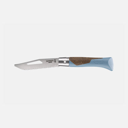 The Opinel Neo 7 Alpine is a versatile folding knife featuring a blue handle, a cork grip, and a partially serrated stainless steel blade with a cut-out near the tip—making it an essential mountain tool for any outdoor enthusiast.