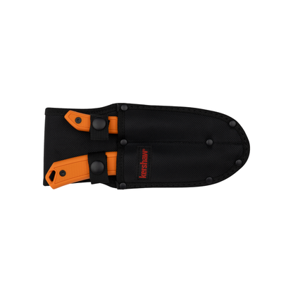 The Kershaw Deschutes Combo features a black nylon double sheath with visible black rivets and a red Kershaw logo, housing two orange-handled fixed blade hunting knives—one slightly smaller than the other—both secured with snap closures.