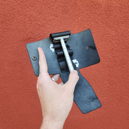 Hand holding open the Jack Raymond Leather Safety Razor Holster with a metal safety razor and razor blade packets inside, highlighting classic shaving essentials.