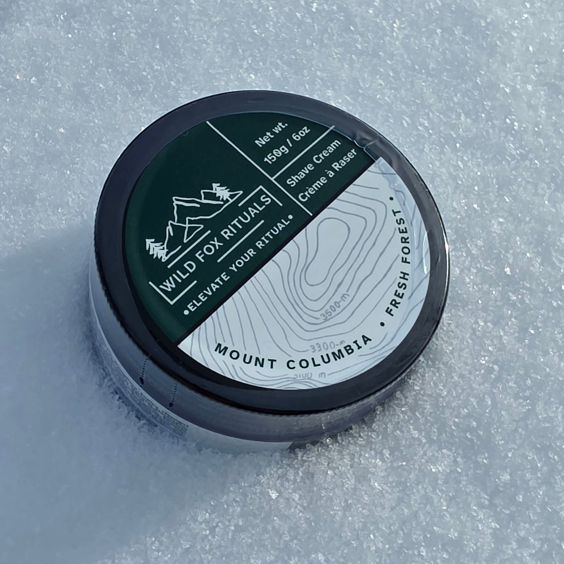 Shave cream container with branding on a snowy background
