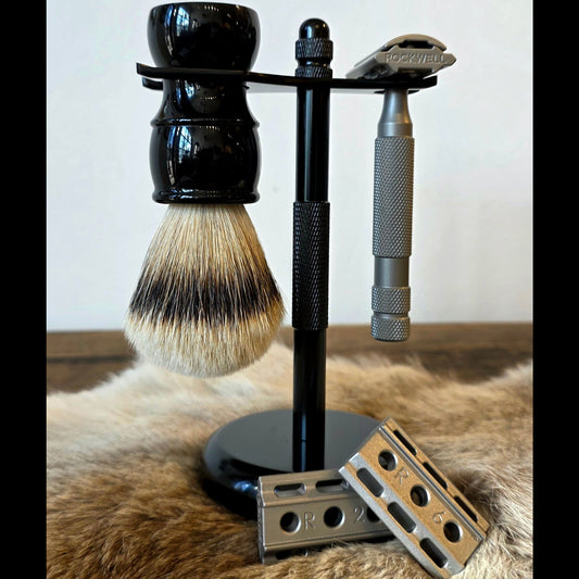 Kent's Best Shaving Kit features a Rockwell 6S razor, silvertip badger brush, and adjustable base plates on a sleek black stand.