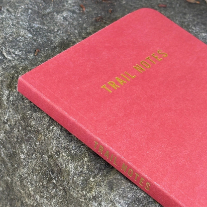Trail Notes notebook, ideal for adventures, features a robust hardcover with gold-stamped title. Perfect for jotting down trail memories and sketching maps.