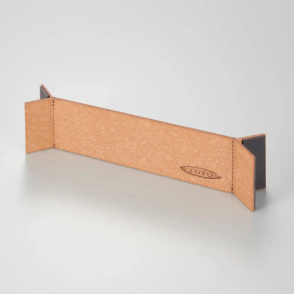 The Toyo 350 series Bonded Leather Partition is a rectangular desk divider with angled gray end panels, echoing Toyo Steel’s toolbox design, and features the YOKO logo embossed on one side against a plain light background.