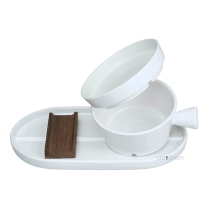 Dovo Shave Ritual - Ceramic Shaving Set: a three-piece kit featuring a white oval base tray, scuttle bowl with removable liner, and wooden razor rest.