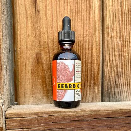 Kent of Inglewood Citrus Beard Oil in a 60 ml amber-glass dropper bottle with a bison graphic, ideal for moisturizing and enhancing beard shine.