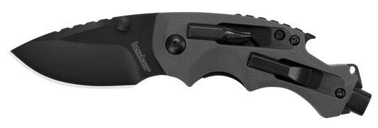 The Kershaw Shuffle DIY is a black folding tactical knife with a partially serrated blade, contoured handle, and built-in multi-tool features such as a screwdriver and glass breaker.
