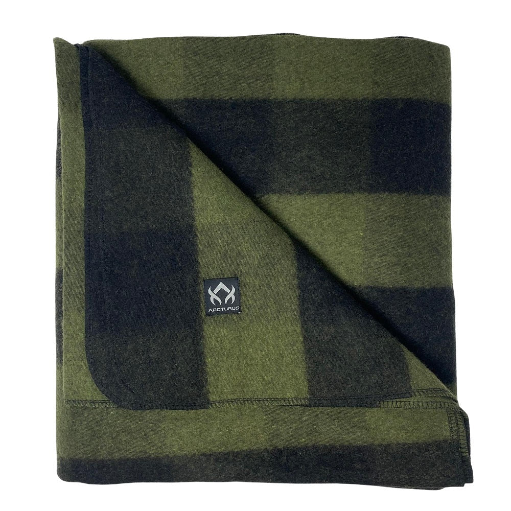 Arcturus Backwoods Wool Blanket - Buffalo Plaid, folded with a green-and-black check pattern, features a woven label. Ideal for outdoor use, blending durability and washability.