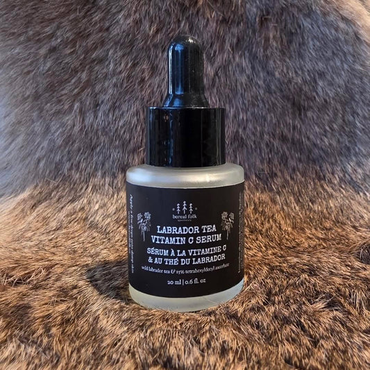 Bottle of Labrador Tea Vitamin C Serum on a fur background