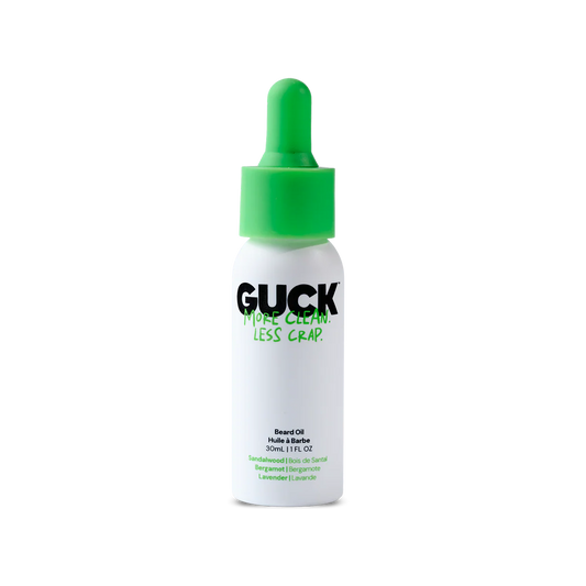 Bottle of GUCK hair gel with green cap on a white background