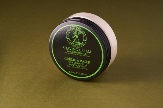 Castle Forbes Lime Essential Oil Shaving Cream 200ml, in a black-and-green jar, partially opened to show the cream inside, ideal for a luxurious shave.
