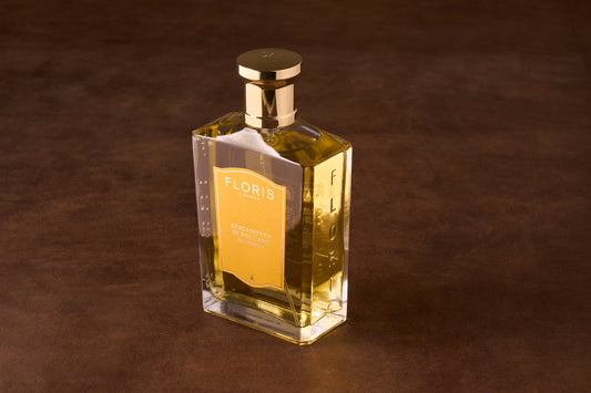Floris Bergamotto di Positano Eau de Parfum in a glass bottle with gold cap, showcasing a luxurious fragrance blend of citrus, vanilla, and warm wood notes.