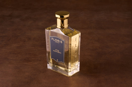 Floris No. 89 Eau De Toilette in a clear glass bottle with a gold cap, showcasing classic English fragrance with citrus and woody notes.