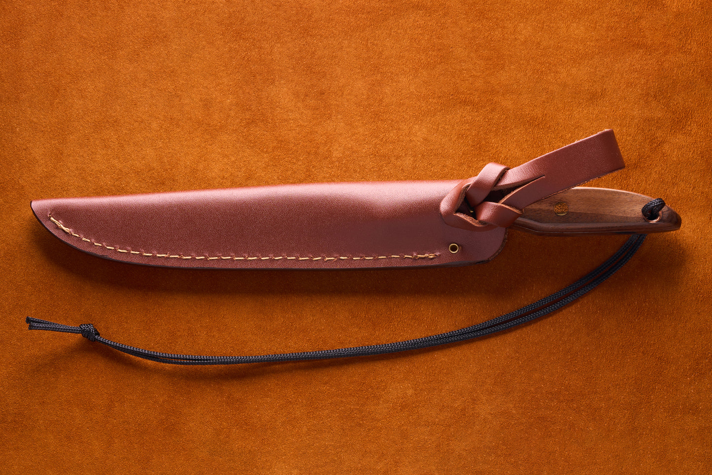 Grohmann D.H. Russell Belt Knife #2 Trout & Bird with Rosewood handle, featuring a stainless steel blade, in a leather sheath with strap and cord lanyard.