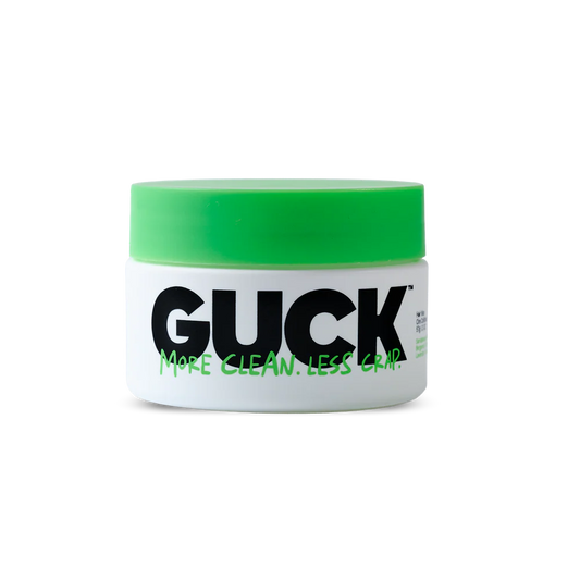 Green and white container that says Guck in black text