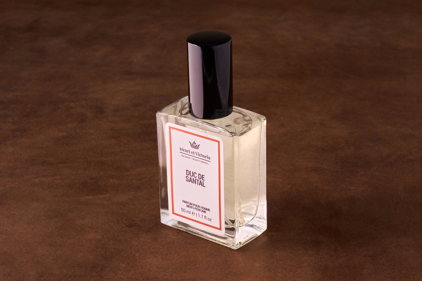 Henri et Victoria Duc de Santal Perfume, a 50 ml glass bottle with black cap, embodies sophisticated musk and sandalwood, ideal for travel.