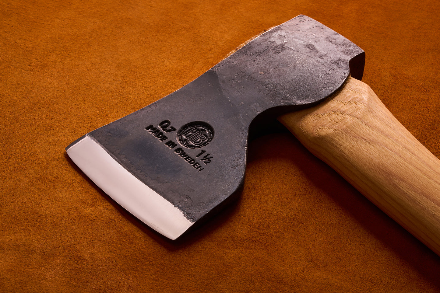 Axes with wooden handles on a brown background