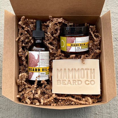 Kent of Inglewood Forest Beard Box: Includes beard oil, balm, and Mammoth Beard Co. cedarwood soap, elegantly presented in a kraft‐paper gift box with crinkle paper.