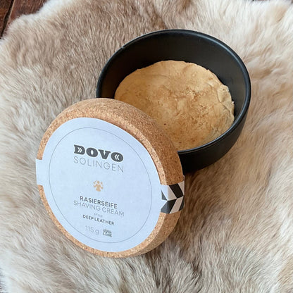 Dovo Deep Leather Shaving Soap in a handmade black bowl with a cork lid, featuring rich notes of oud and sandalwood.