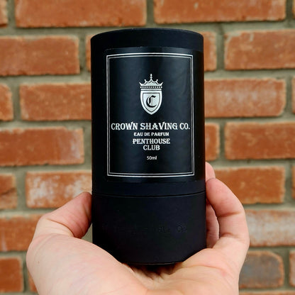 Crown Shaving Co. Penthouse Club Eau de Parfum 50mL, a matte-black tube with silver label, offering a fresh, woody scent for confident everyday wear.