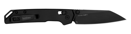 Kershaw Iridium Reverse Tanto pocket knife with black D2 tool steel blade, visible pocket-carry clip, and thumb-stud/flipper for one-handed opening, showcasing precision-focused design.