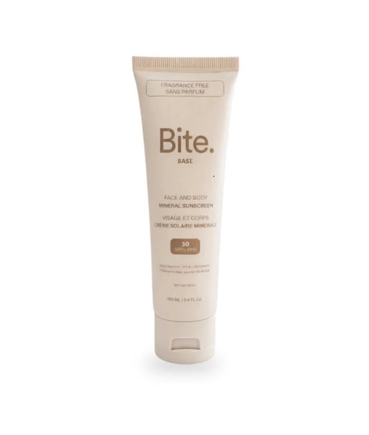 A beige tube of Bite Base Mineral Sunscreen SPF 30, labeled as fragrance-free, offers broad-spectrum protection and is isolated on a white background.