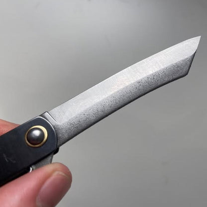 Higo Knife, a traditional Japanese folding pocket knife, features a tanto-shaped blade with liner-lock, crafted by Mitsuo Nagao with Yasugi District SK carbon steel.