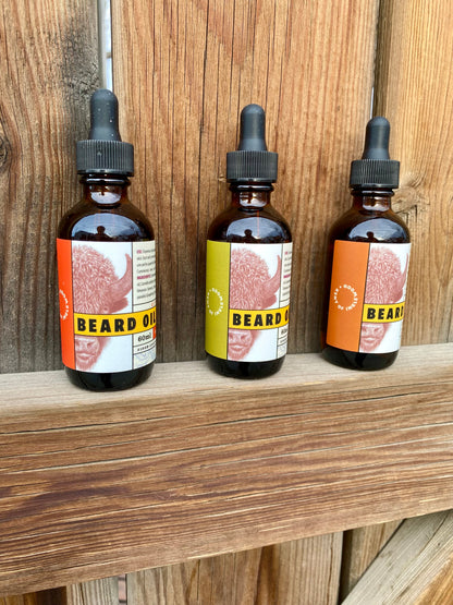 Kent of Inglewood Citrus Beard Oil bottles on a wooden shelf, designed to enhance beard shine and moisture with jojoba, argan, and camelia oils.
