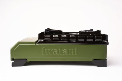 A side view of the Iwatani Cassette Konro "Tough Maru" Portable Stove in green and black, powered by butane, displayed on a white background.