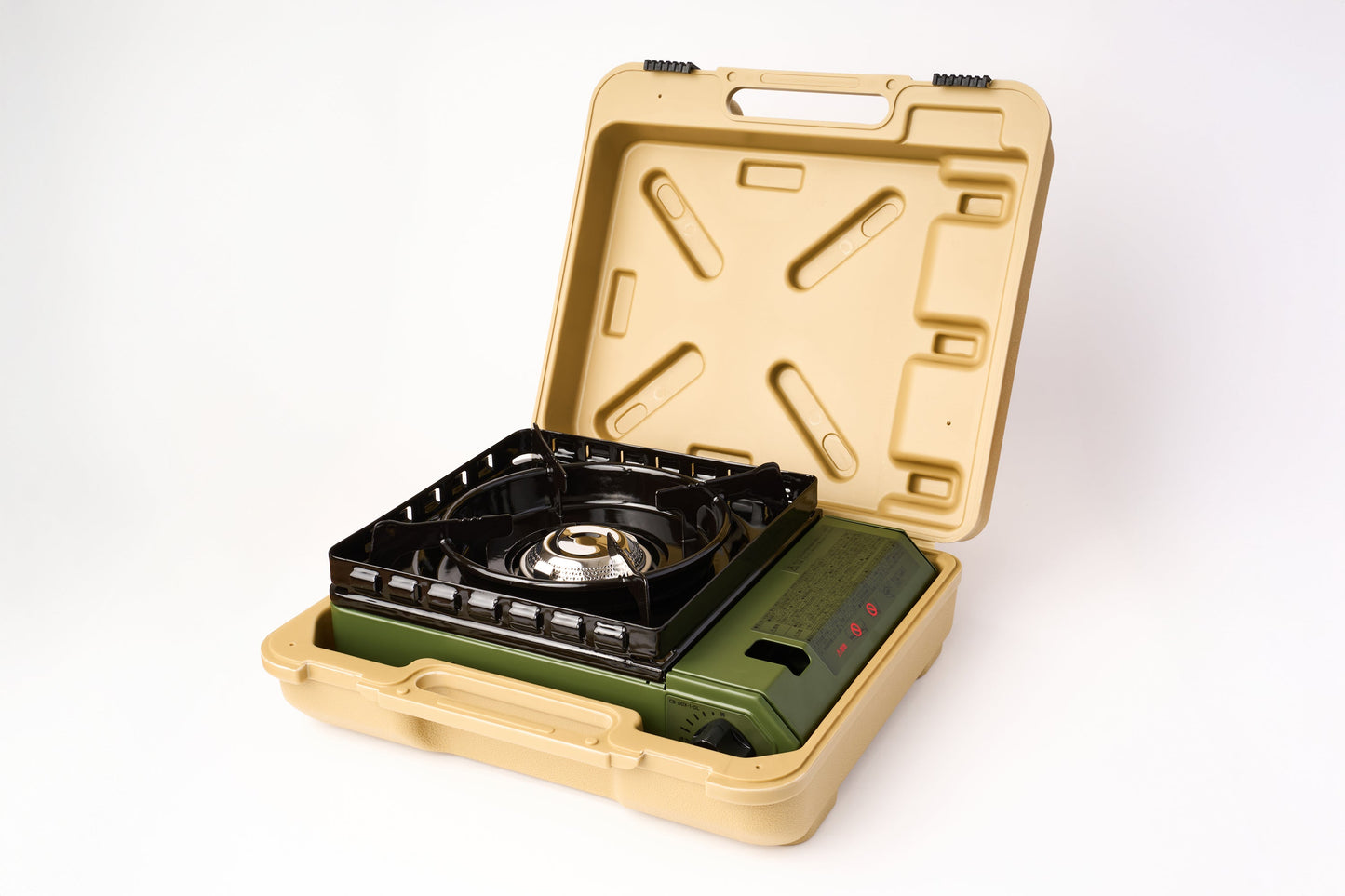 The Iwatani Cassette Konro "Tough Maru" Portable Stove is placed inside an open beige carrying case, displayed on a white background.