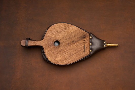 Koen Fire Bellows, handcrafted from wood with dark leather sides and a brass nozzle.