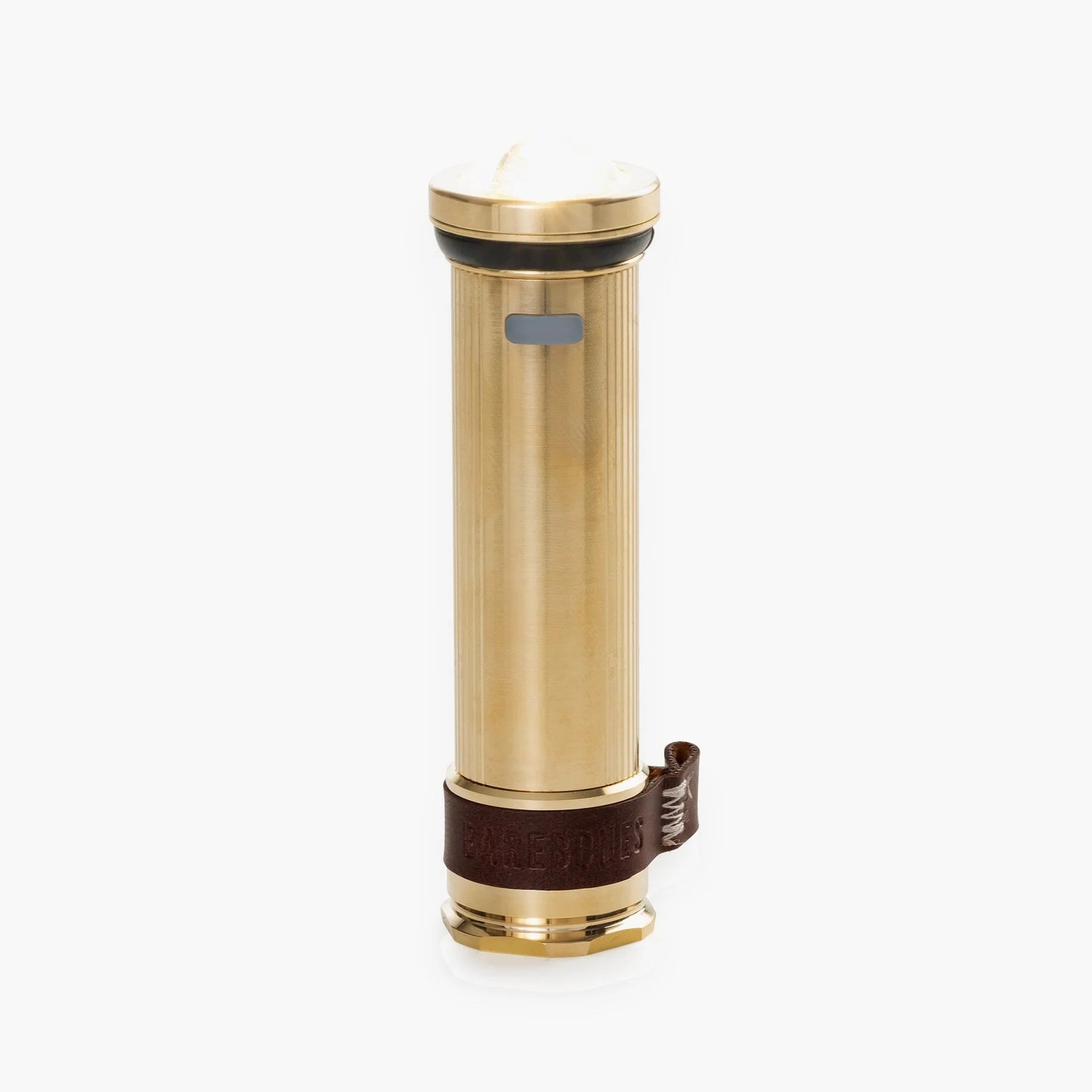 Barebones Mini Flashlight with machined brass body, flat hex base, leather strap, magnetic base, USB-C rechargeable, ideal for versatile outdoor use.