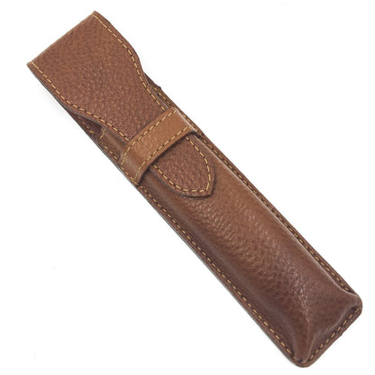 Brown leather pen holder on a white background