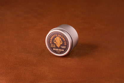 Mammoth Beard Co. Beard Balm Sex & Cigars, 51g tin, offers light hold and moisture with a smoky, sweet scent, ideal for taming unruly beards.