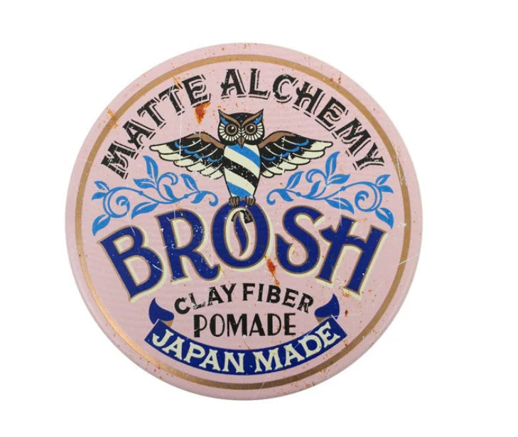 Round container of Matte Alchemy Brosh Clay Fiber Pomade with owl illustration on a white background