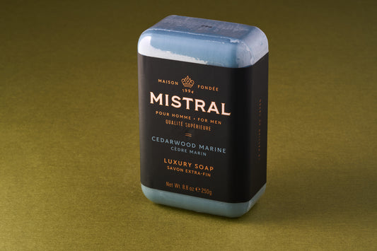 Mistral For Men Cedarwood Marine Bar Soap, elegantly wrapped, offers a luxurious, long-lasting lather with a refreshing, forest-ocean fragrance. Perfect for a classic shaving experience.