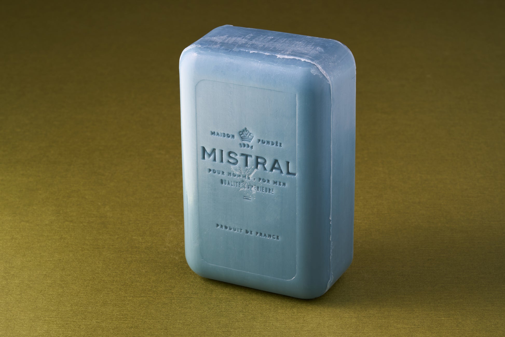 Mistral For Men Cedarwood Marine Bar Soap, embossed with “MISTRAL,” offers a smooth lather and rich fragrance, crafted in France. Perfect for a refreshing, luxurious cleanse.