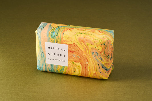 Mistral Marbles Citrus Bar Soap wrapped in marbled paper with a white label, offering a luxurious, smooth, and fragrant triple-milled experience.