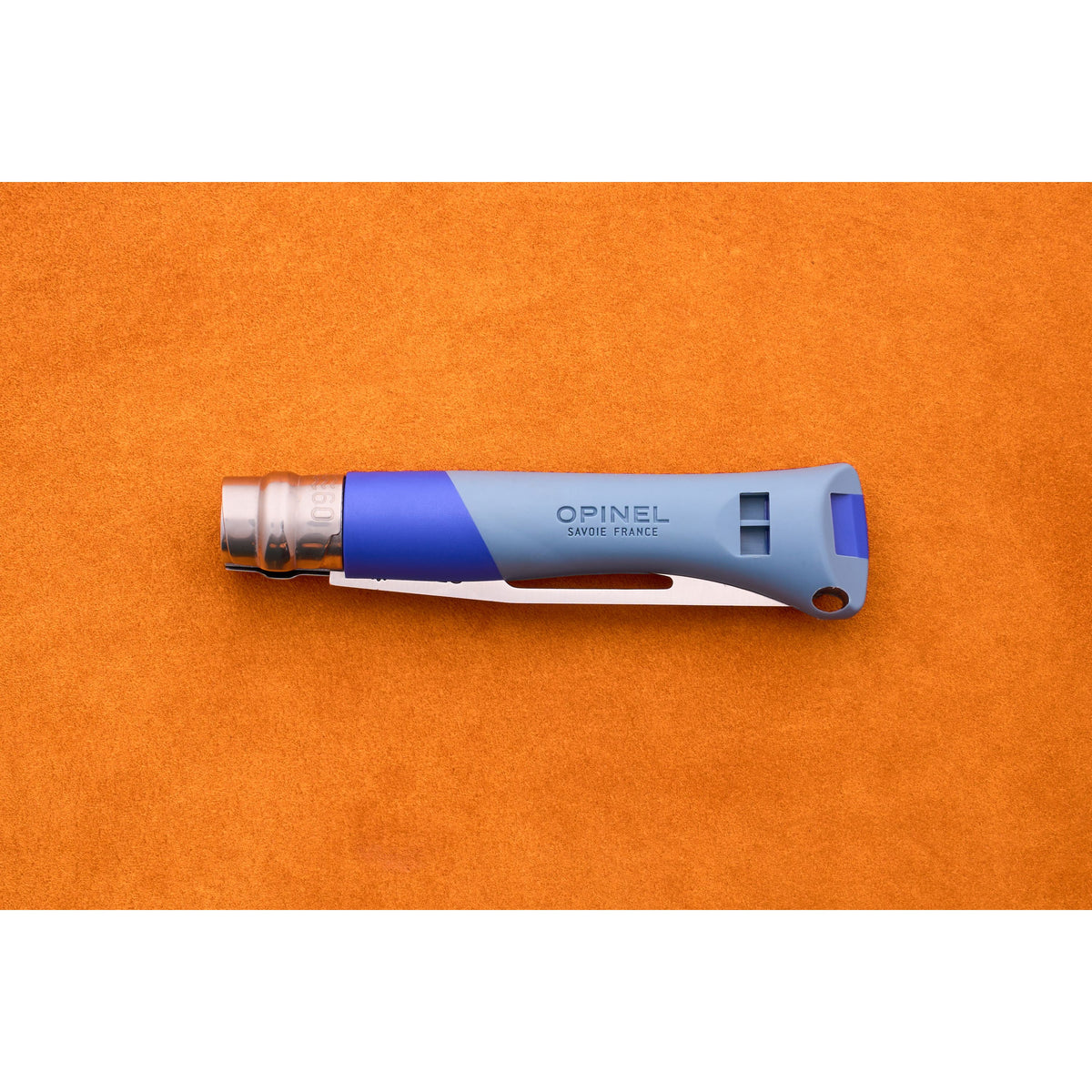 The Opinel No. 9 Ocean, a closed folding knife with a blue handle and silver blade designed for sailing, rests on an orange textured surface.