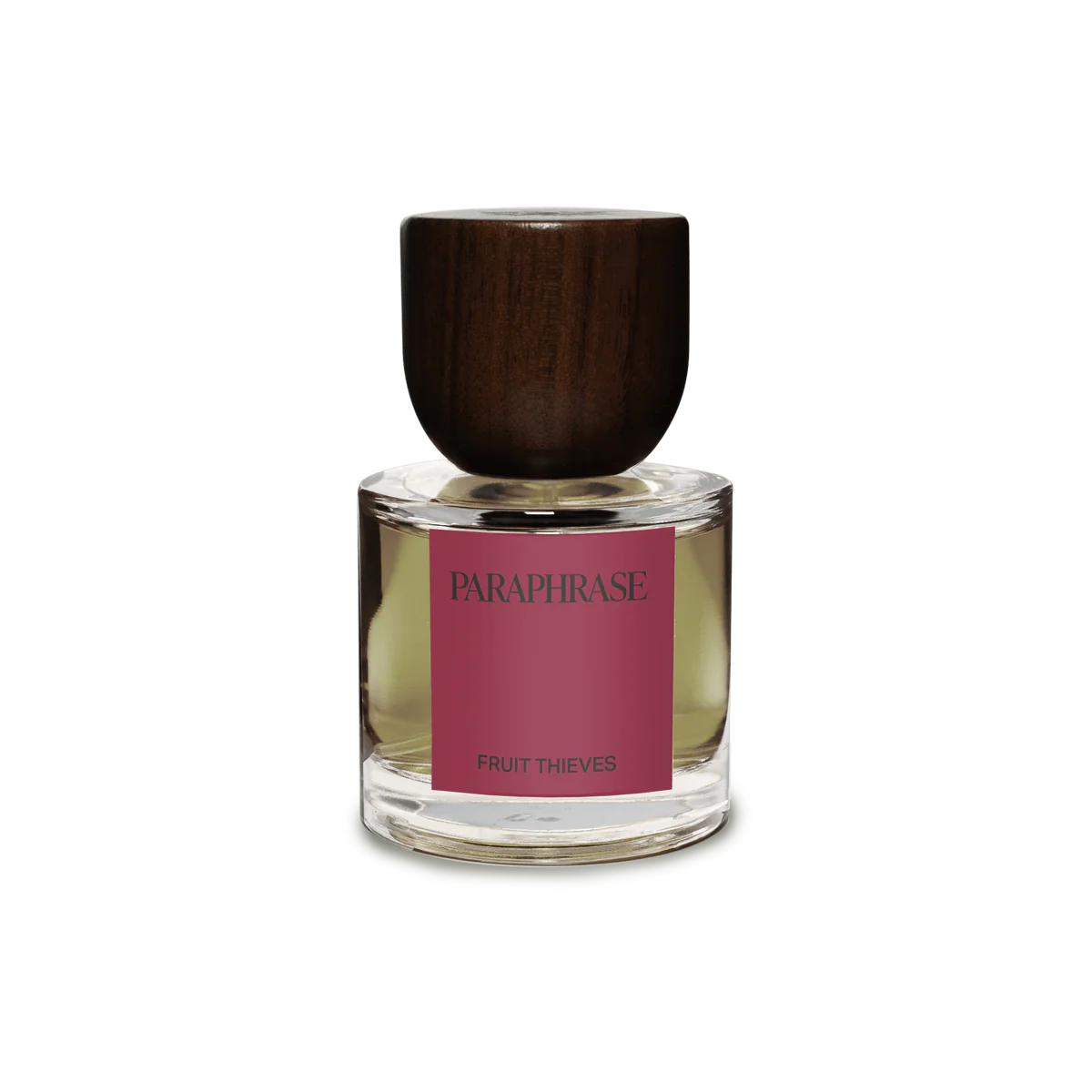 Perfume bottle with wooden cap and pink label on a white background